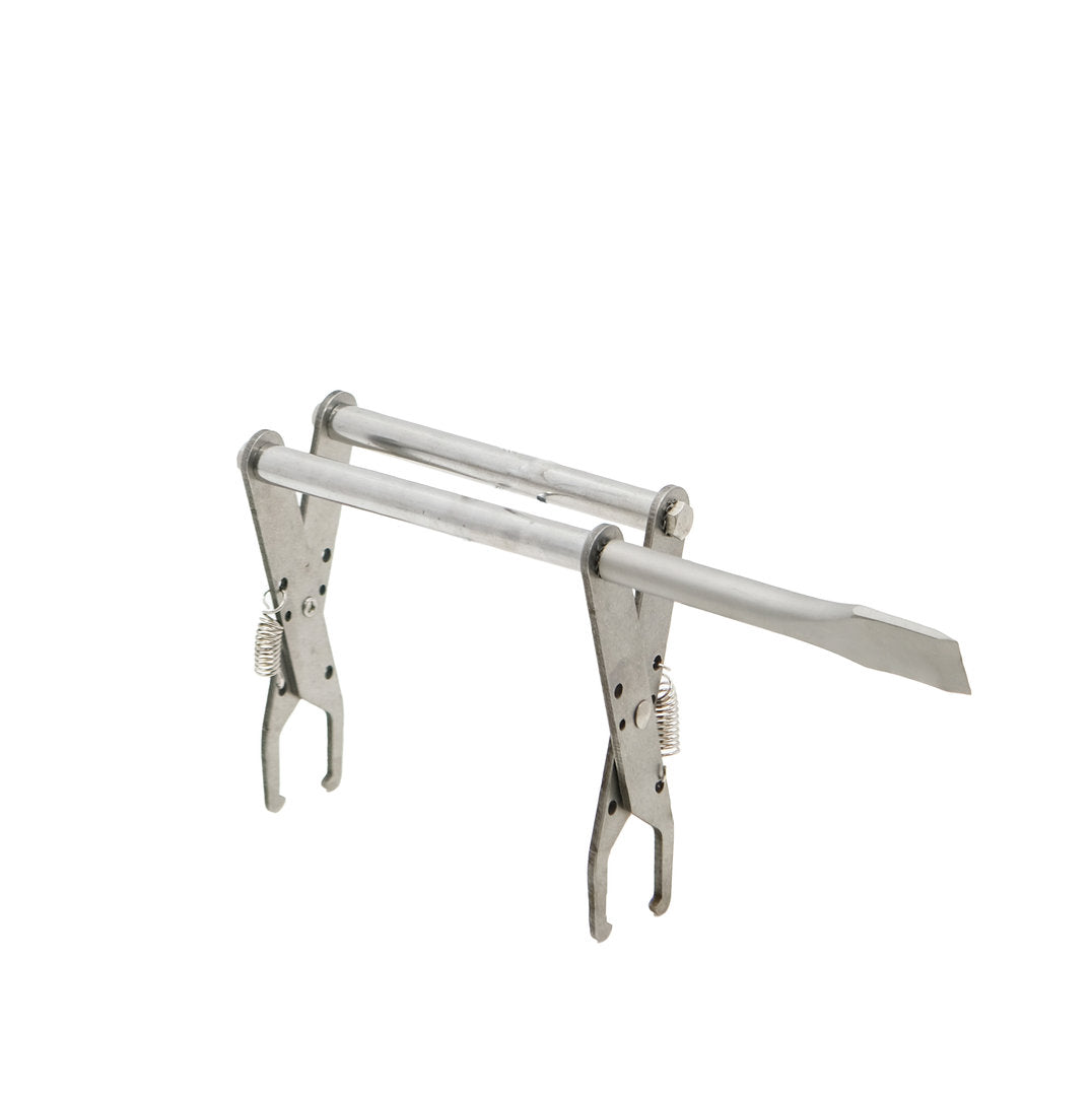 Stainless steel honeycomb extractor pliers with hive chisel and return spring.